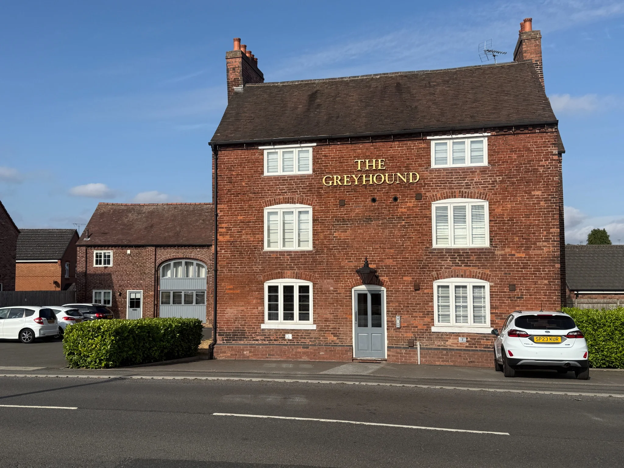 Completed Greyhound Public House and surrounding residential development