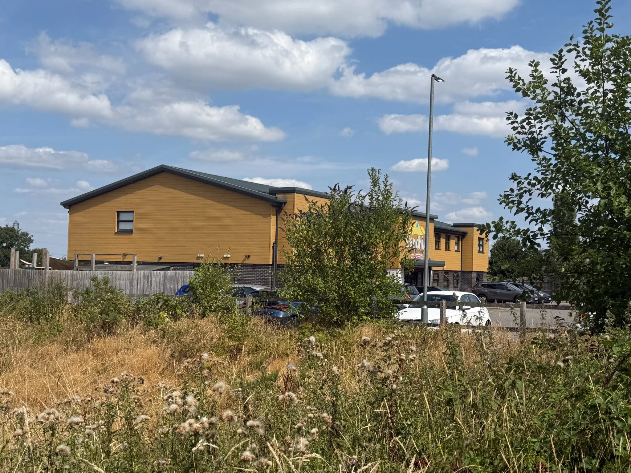 Sandhill Day Nursery viewed within its landscaped rural-edge setting