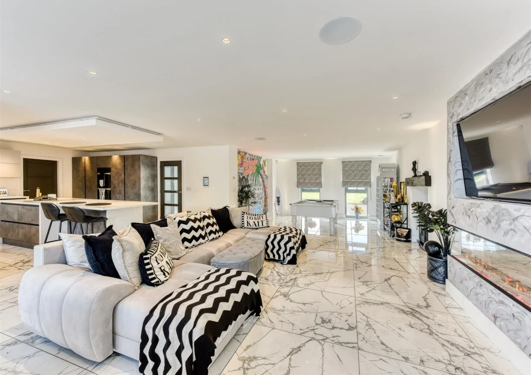 Open-plan kitchen and living space within an adjoining home