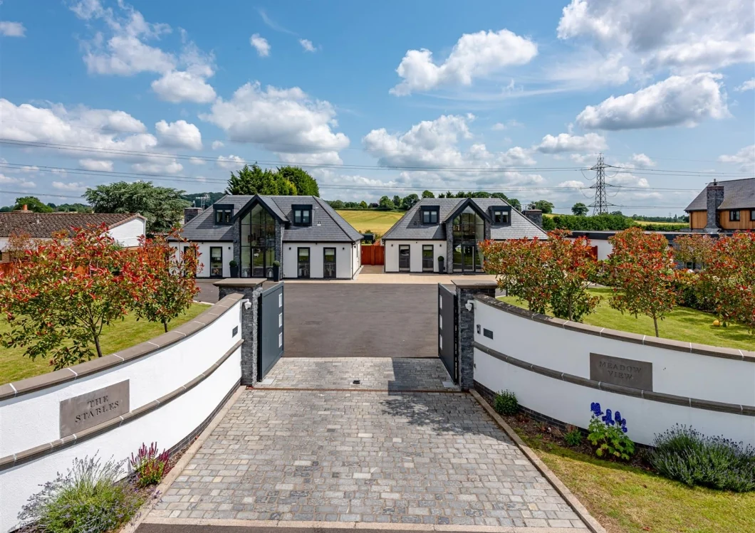 Gated landscaped arrival to the two adjoining homes