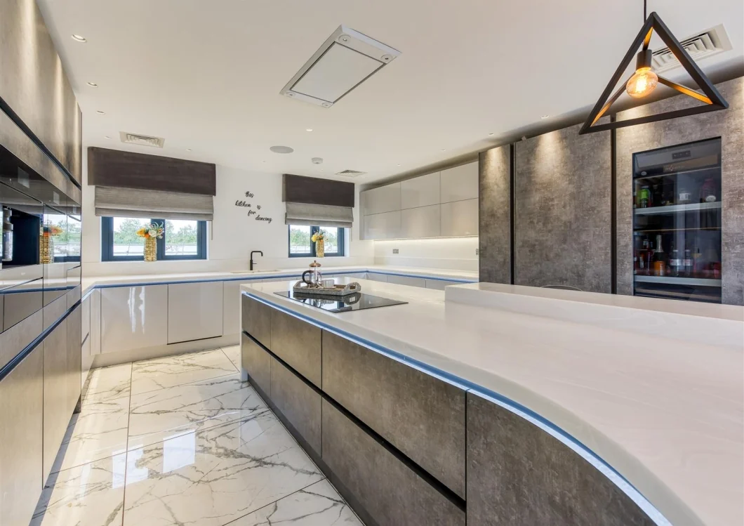 Contemporary kitchen with sculpted island and coordinated finishes
