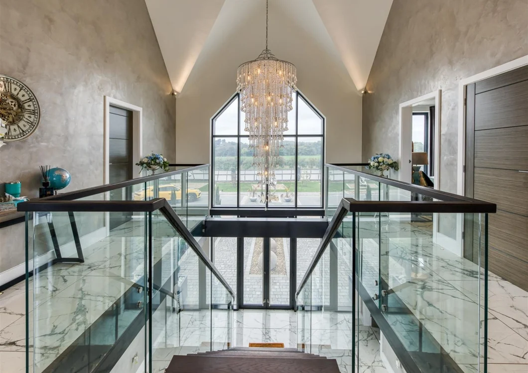 Upper landing and glazed atrium overlooking the landscaped entrance