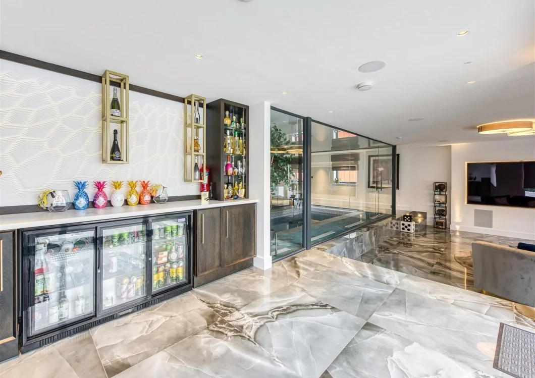 Leisure suite with bar and full-height glazing to the indoor pool