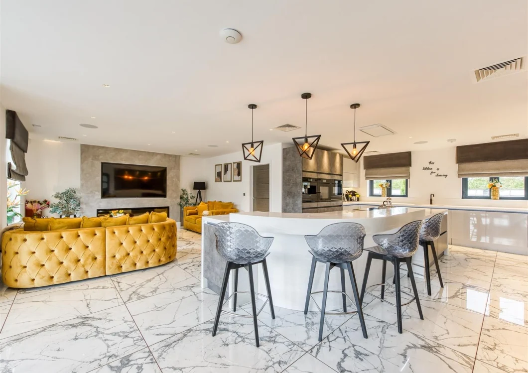 Open-plan kitchen and living space within the completed residence