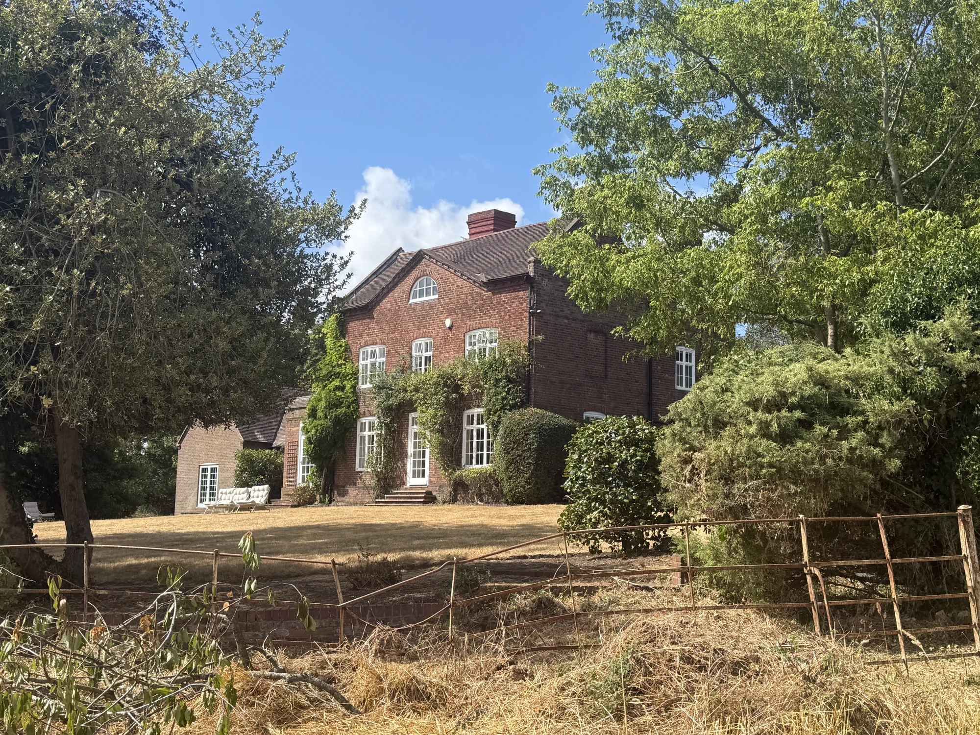 Stourton House within its established estate setting